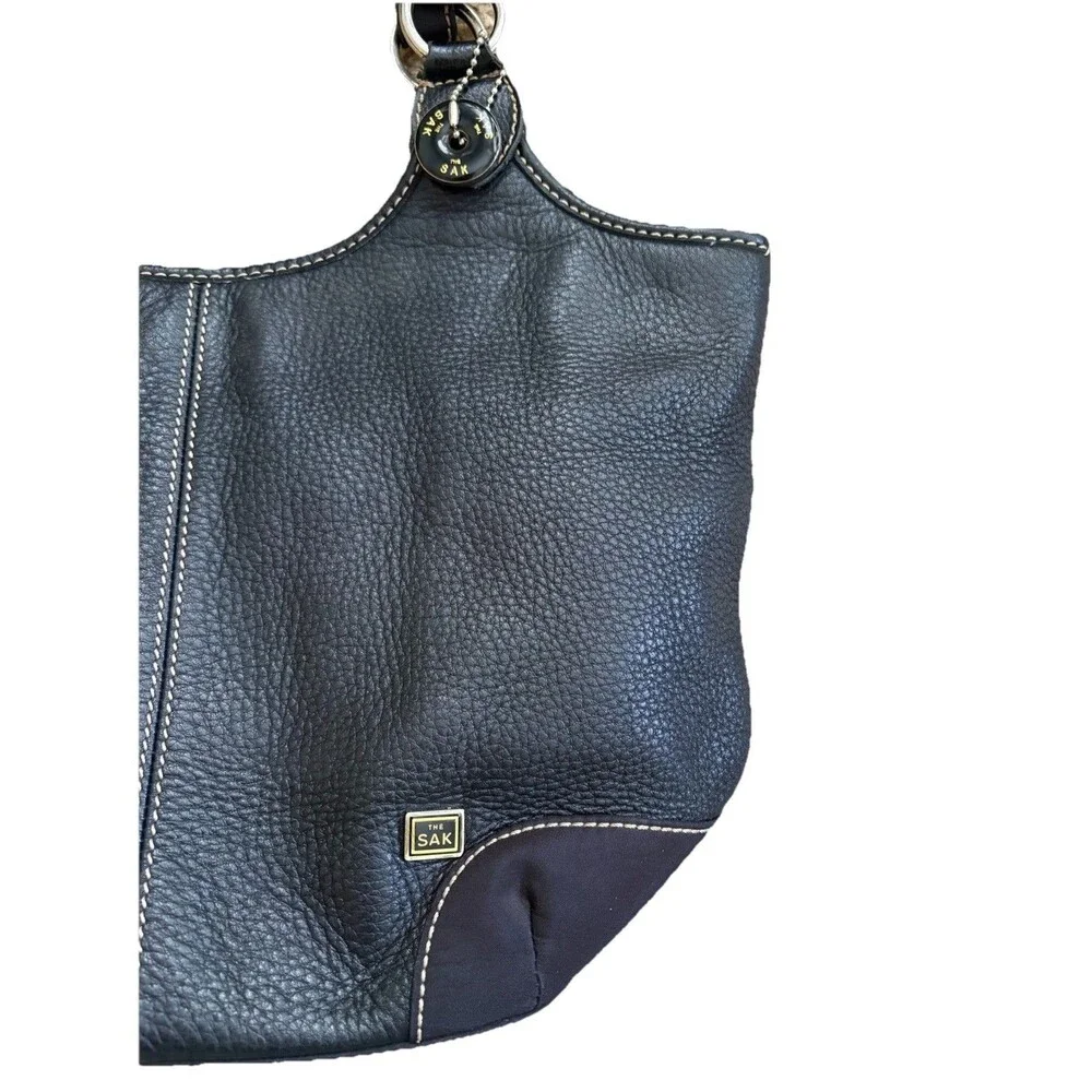 The Sak Black Pebbled Leather Shoulder Bag Buckles Silver Hardware Stitching
